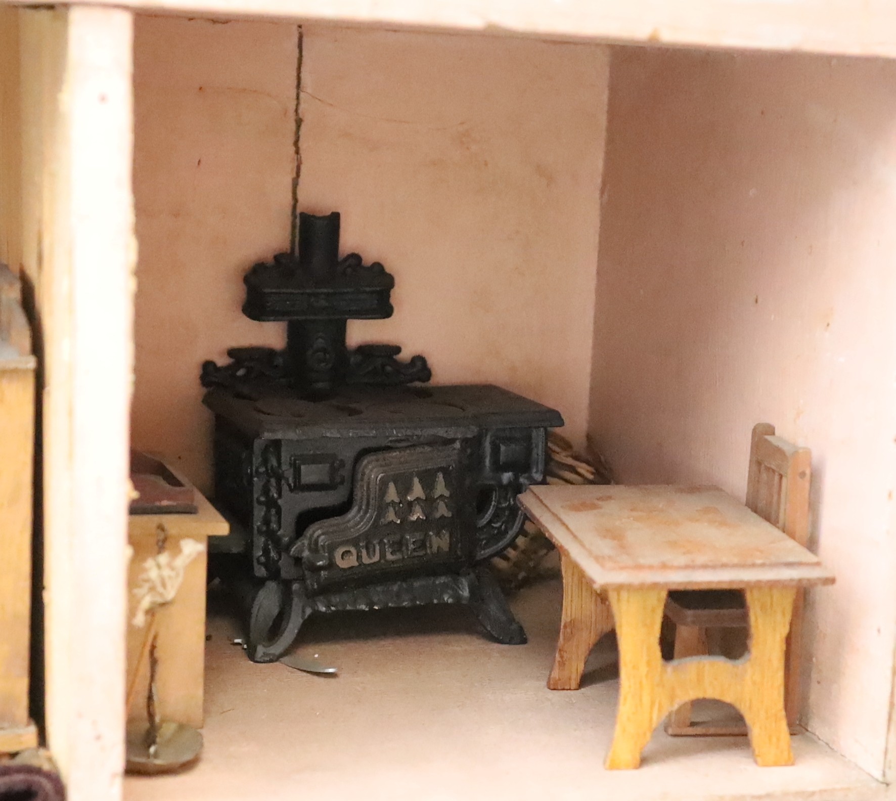 A Victorian furnished dolls’ house, circa 1890, 77cm high.